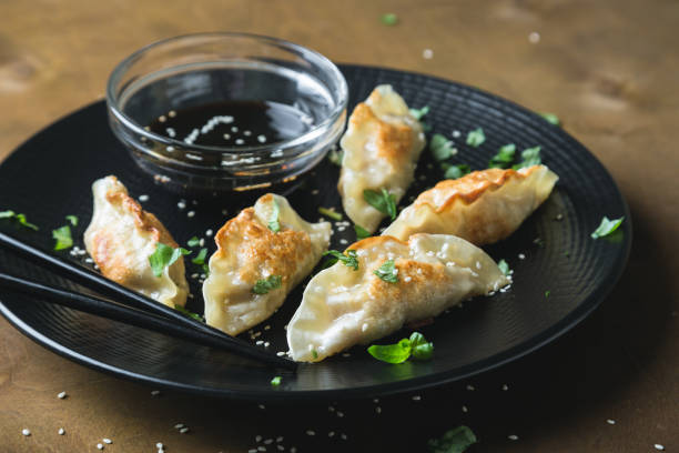 istock Asian fried dumplings with soy sauce 1179143520