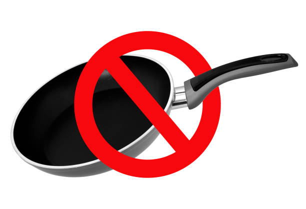 Chemicals in cookware, non stick frying pan. PFAs ie polytetrafluoroethylene, perfluoroalkyl and polyfluoroalkyl aka PFOA,PFNA, PFTE. Potentially dangerous chemicals in cookware, non stick frying pan. PFAs ie polytetrafluoroethylene, perfluoroalkyl and polyfluoroalkyl aka PFOA,PFNA, PFTE. polytetrafluoroethylene photos stock pictures, royalty-free photos & images