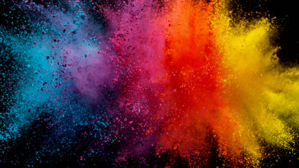 istock Explosion of colored powder on black background 1179145432
