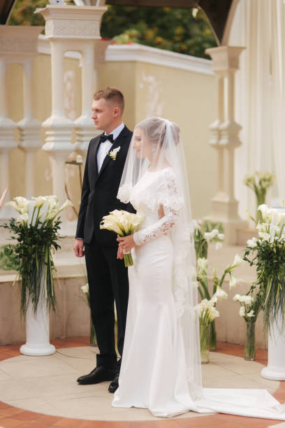 istock Groom and bride on wedding ceremony outside 1179146508