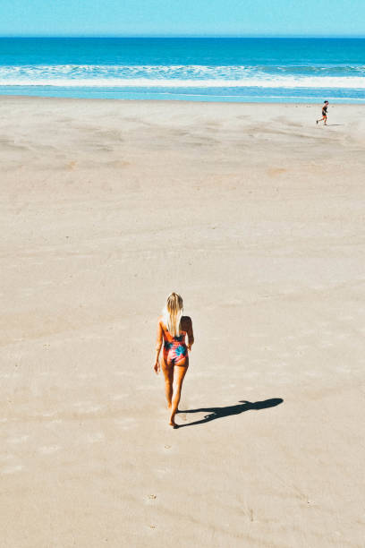 istock Women walking on the beach 1179146655