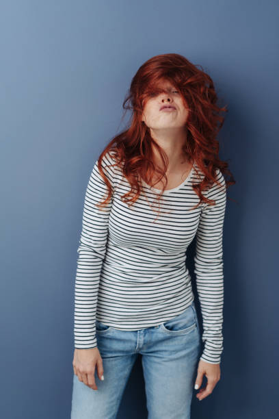 istock Young woman with mussed long red hair 1179146748