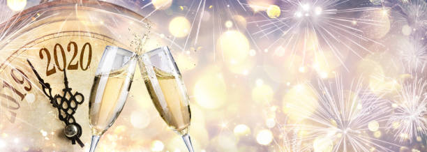istock happy New Year 2020 - Toast With Champagne And Clock 1179146872