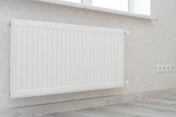 istock Individual heating radiator on a wall at an apartment. 1179146902