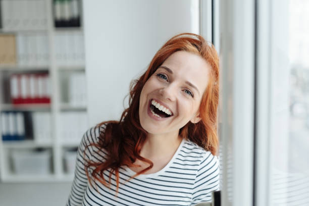 istock Laughing vivacious woman enjoying a joke 1179148578