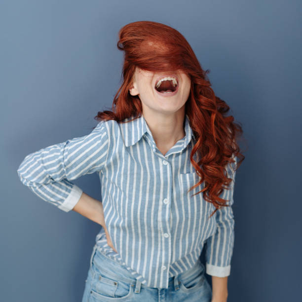 istock Young woman enjoying a good laugh 1179148980