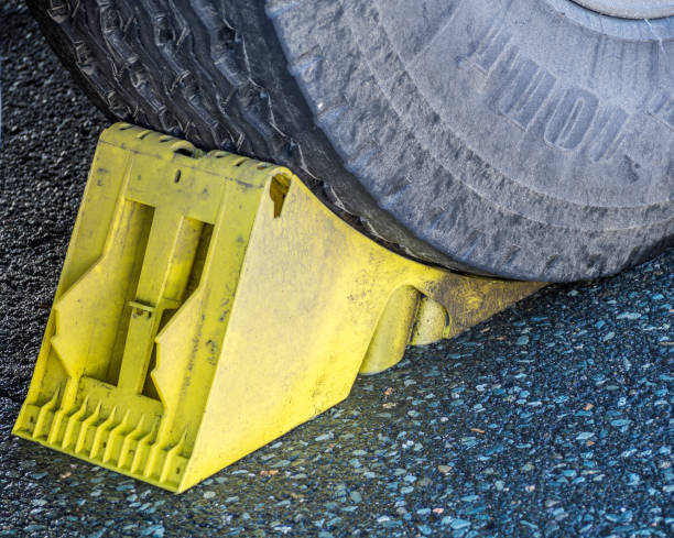 istock Wheel chock under a truck Wheel 1179149033