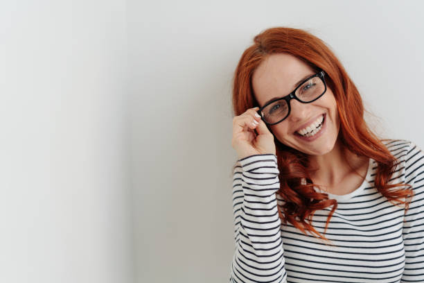 istock Laughing vivacious young redhead woman 1179149440