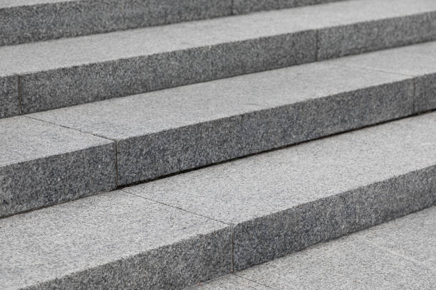 istock Gray stone steps on the street 1179150023