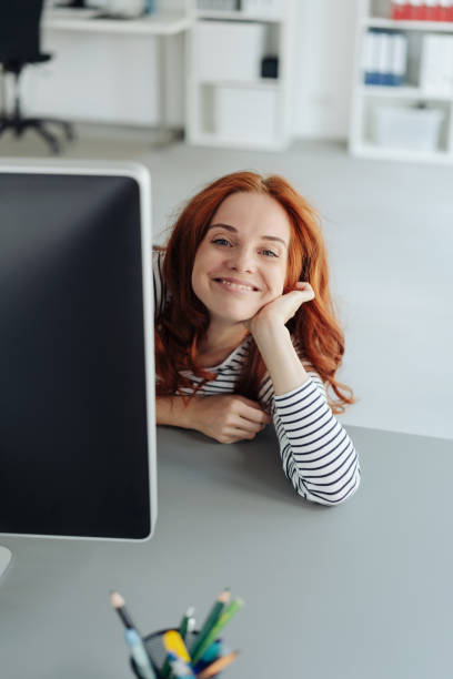 istock Happy young woman grinning at the camera 1179150362