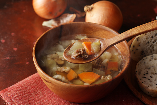 Consomme transparent soup with vegetables and beef