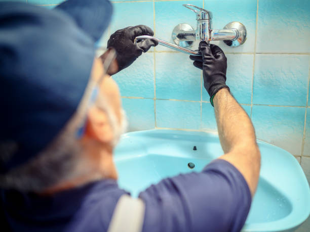 Installing a faucet stock photo