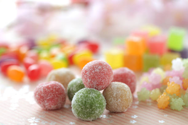 Strawberries, dumplings, jelly and beans on a pink background