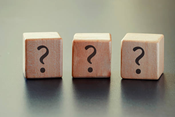 istock Three question marks on a row of wooden blocks 1179152631