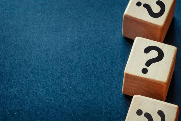 istock Side border of question marks on wooden cubes 1179152637