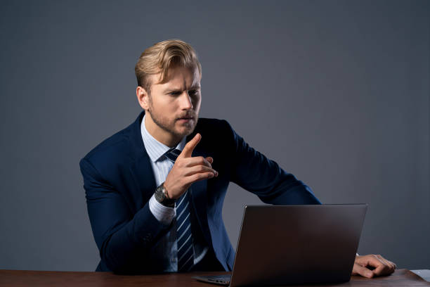 istock smart businessman caucasian  formal suit focus concentrate working with data from laptop screen business ideas concept 1179153882
