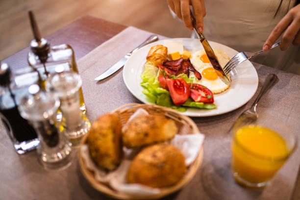 istock Young woman having breakfast 1179153974
