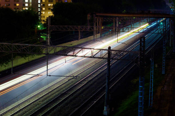 istock The train rushes along the rails at night 1179154463