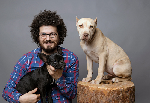 Man posing with his pets