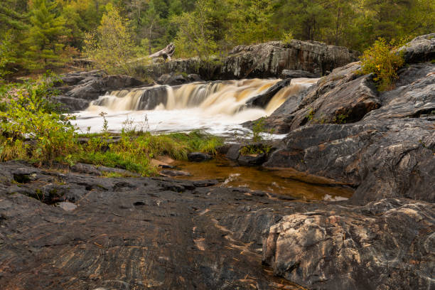 istock Eau Claire River Waterfall In Autumn 1179157467