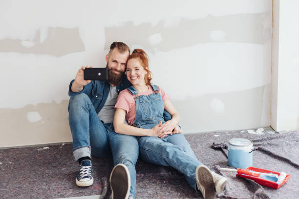 istock Smiling loving young couple posing for a selfie 1179157533