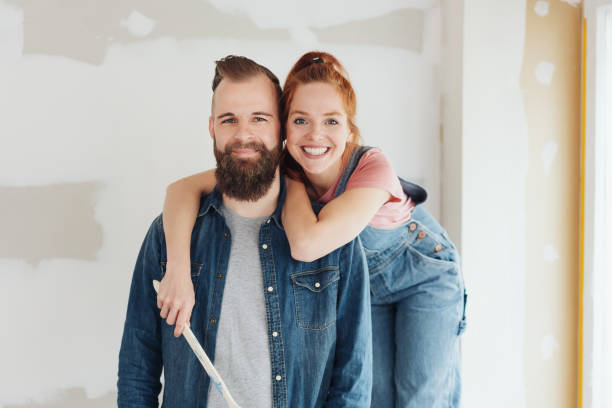 istock Happy young couple posing in their new home 1179157564