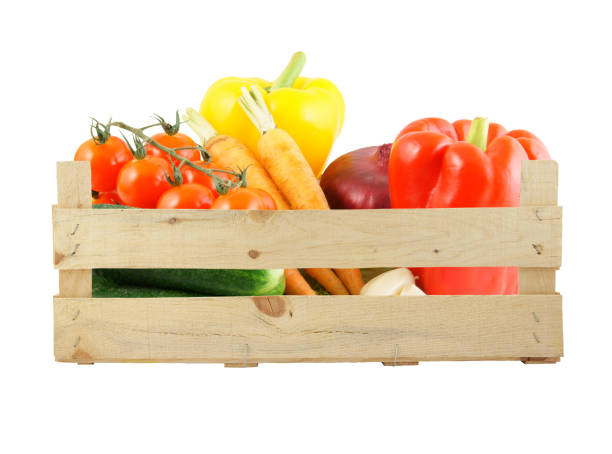 istock Vegetables in wooden box isolated 1179157591