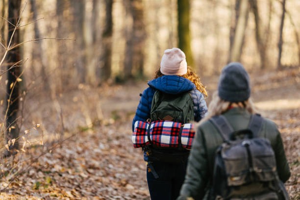 istock girls in the forest 1179158171