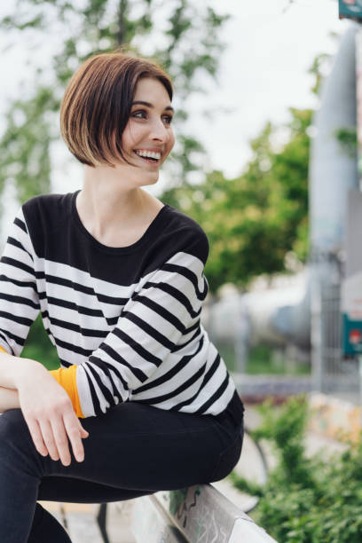 istock Happy young woman turning with a smile 1179159536