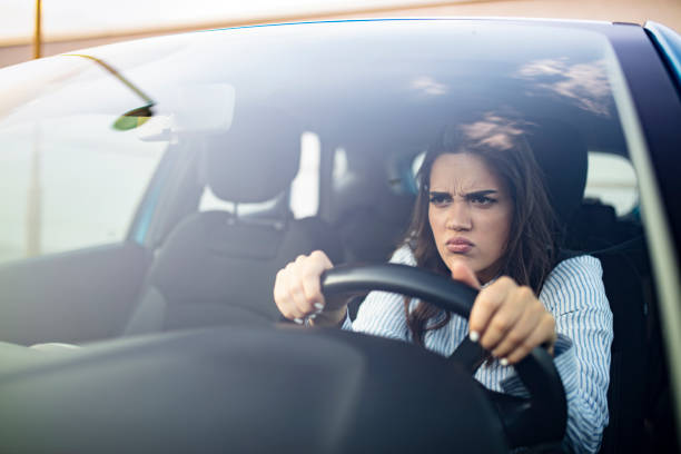 istock Stressed woman driver sitting inside her car. 1179160831