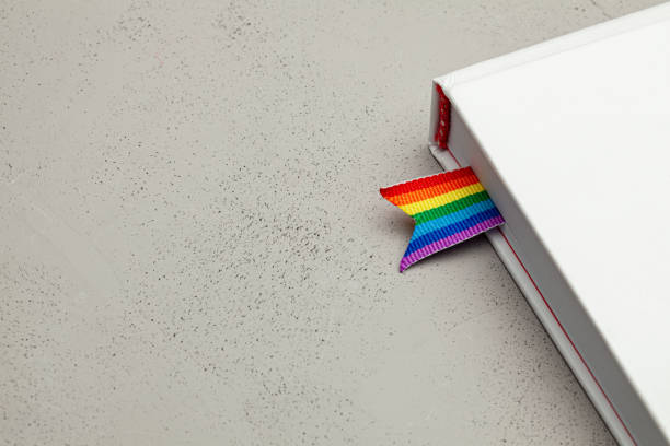 Book with bookmark and rainbow ribbon of LGBT pride stock photo
