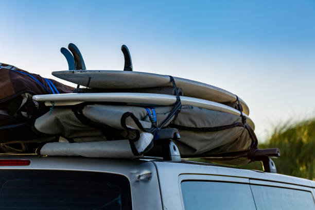 istock Surfboards fixed on a top of a car. Surftrip. 1179162289