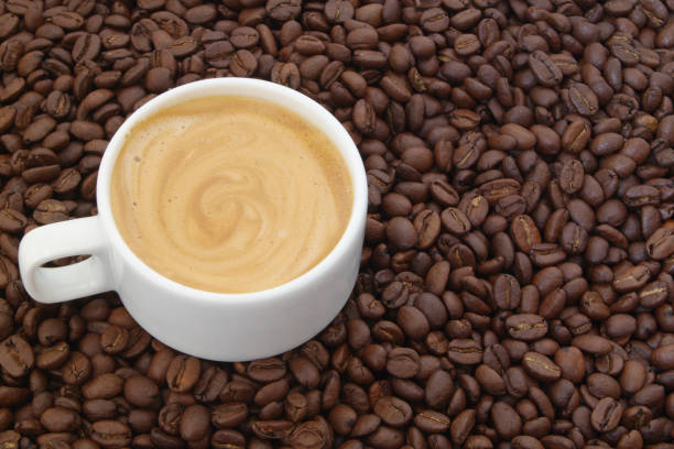 istock Cup of coffee on coffee beans 1179162454