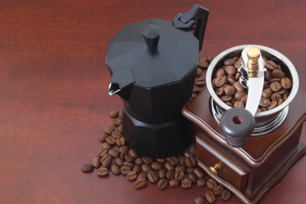istock Moka pot, manual coffee grinder with coffee beans 1179162821