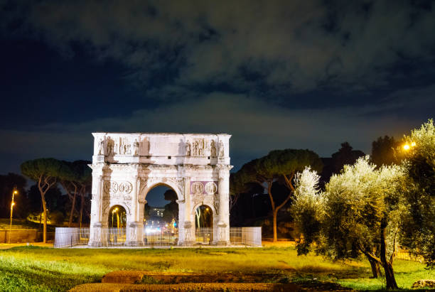 Nighttime view of the Arch of Constantine in Rome, Italy