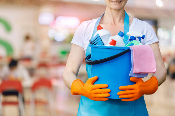 istock The cleaning lady standing with a bucket . 1179163679