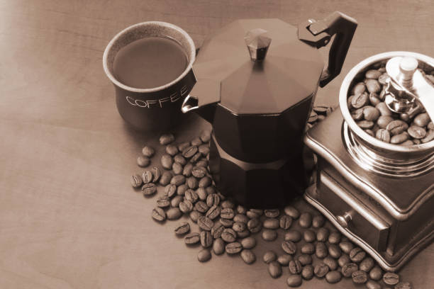 istock Vintage manual coffee grinder with coffee beans on table 1179163912