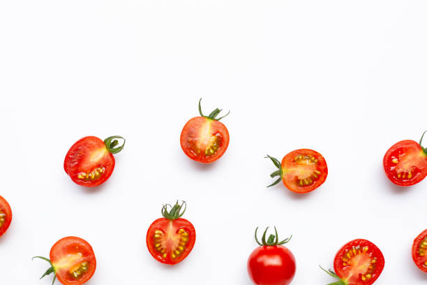istock Fresh tomatoes, whole and half cut isolated on white background. 1179166945