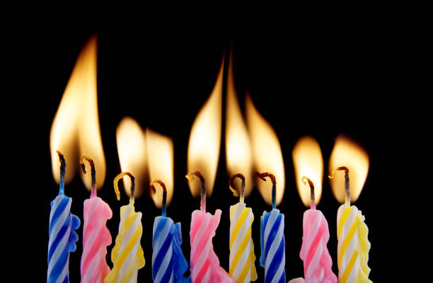 istock Birthday candles on black 1179167899