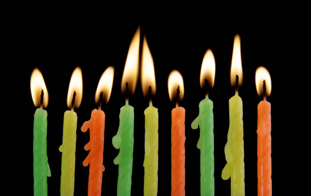 istock Birthday candles on black 1179167979