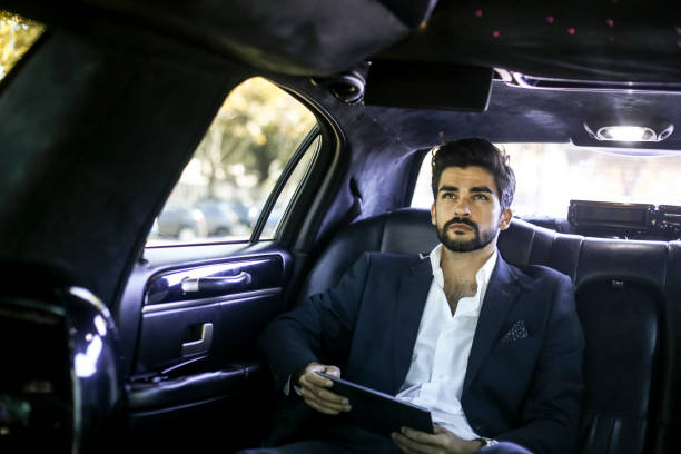 istock CEO watching TV in car 1179176672