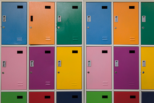Colorful children's lockers in a row in the hallway of the elementary school.
