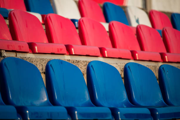istock Blue, red and white chairs in the stadium 1179180391