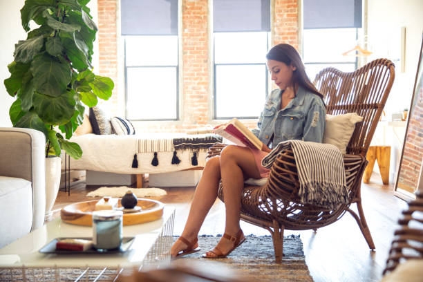 istock Young woman spending a relaxing day in her beautiful home 1179180597