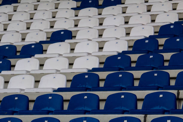 Close-up taken of Empty benches of substitute players and coaches on the sidelines of the stadium
