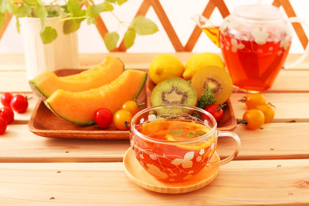 Fruits,  Cup of tea   and sandwich on   wooden boards