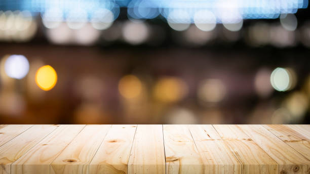 istock Empty wooden table platform and bokeh at night 1179185390