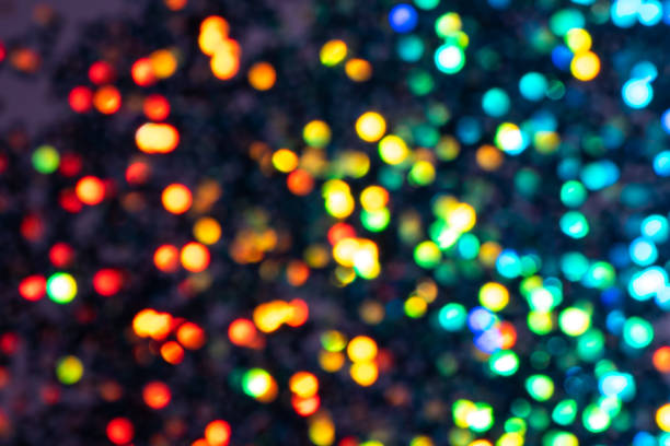 istock Colorful prism confetti blurred festive backdrop, trendy sparkles and glitter background, flat lay style. Christmas and holidays concept 1179186279