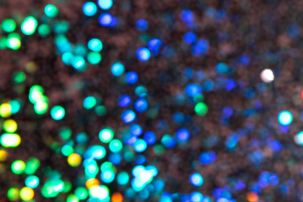 istock Colorful prism confetti blurred festive backdrop, trendy sparkles and glitter background, flat lay style. Christmas and holidays concept 1179186319