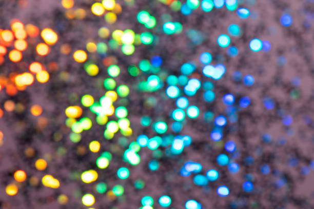 istock Colorful prism confetti blurred festive backdrop, trendy sparkles and glitter background, flat lay style. Christmas and holidays concept 1179186403